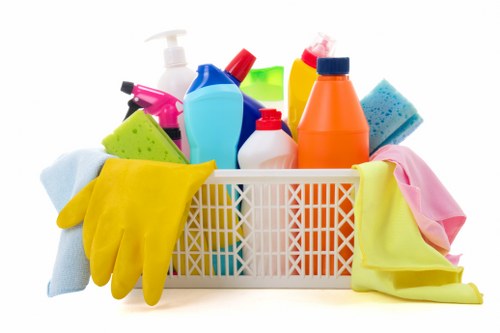 Carpet cleaning professional working safely in a home interior