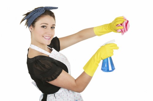 Office cleaning team sanitising desks and shared surfaces in Hollandpark